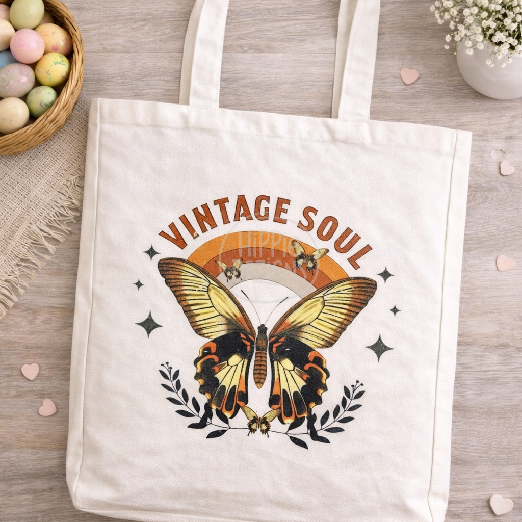 Tote bag with butterfly design and 'Vintage Soul' text on a wooden surface.